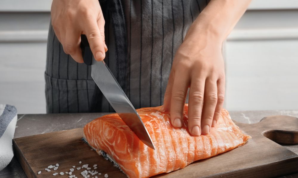 Why Do Sushi Chefs Hold Knives with One Finger on Top? A Deep Dive